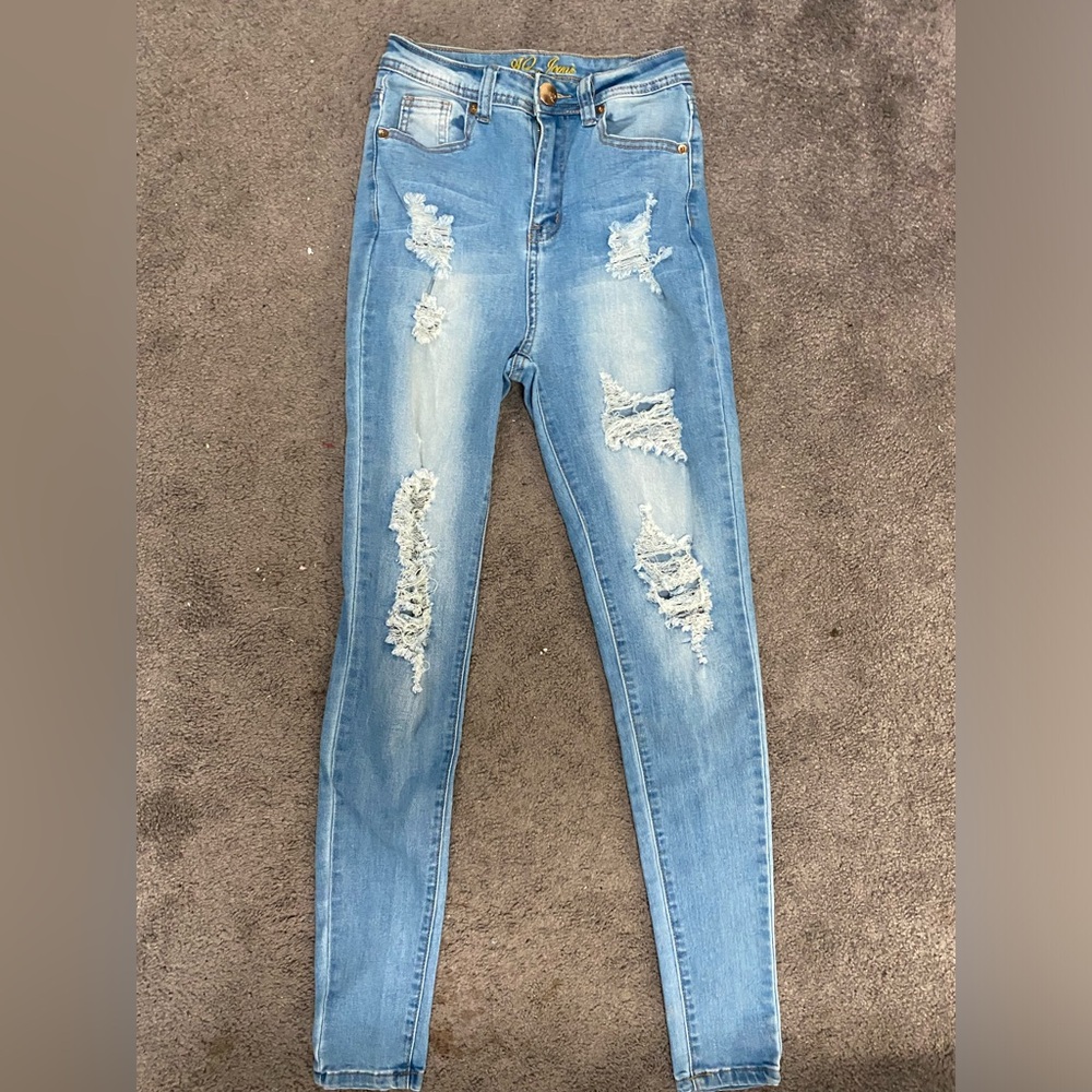 AQ Women's Distressed Blue Jeans.